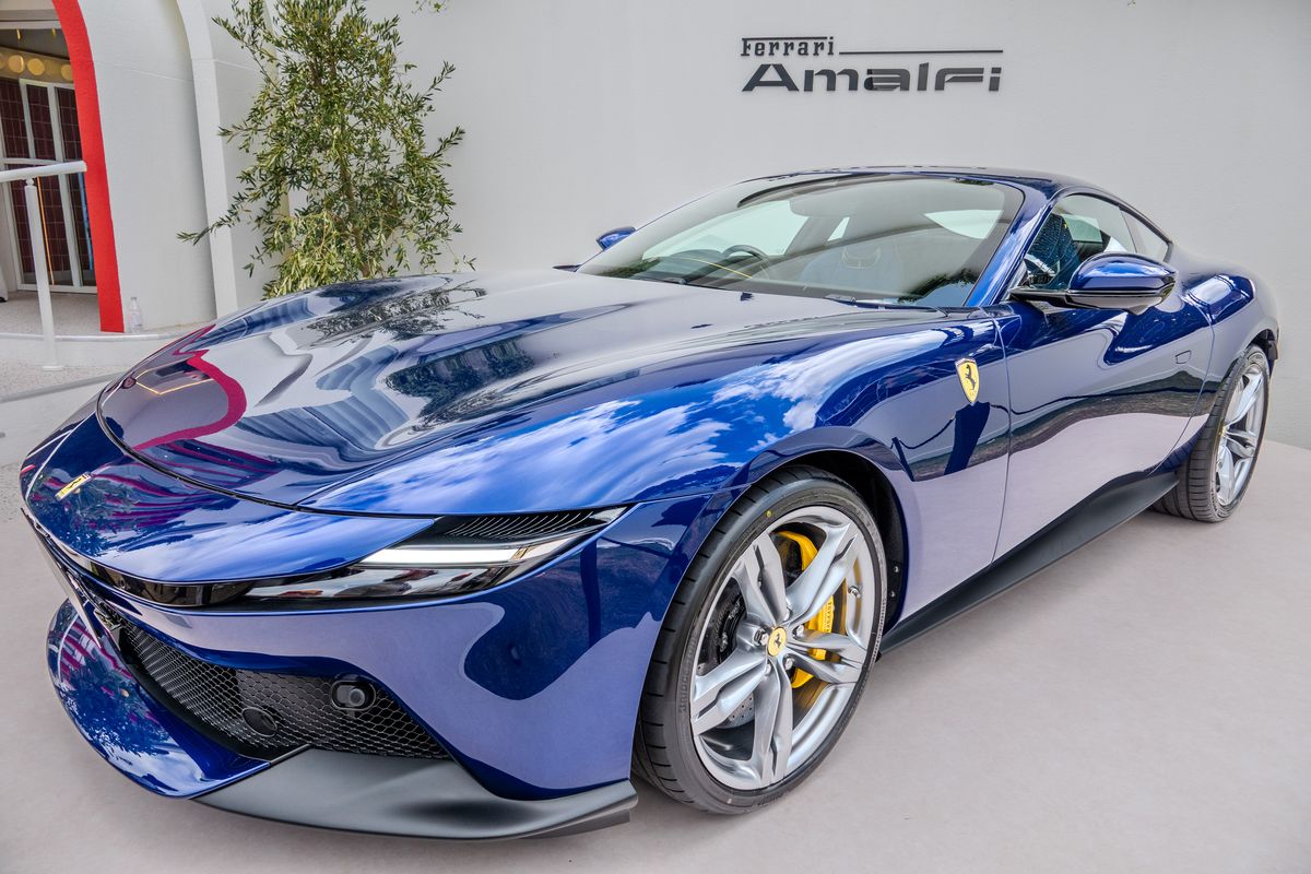 Blue Ferrari Amalfi grand tourer, low front three-quarter view with yellow brake calipers