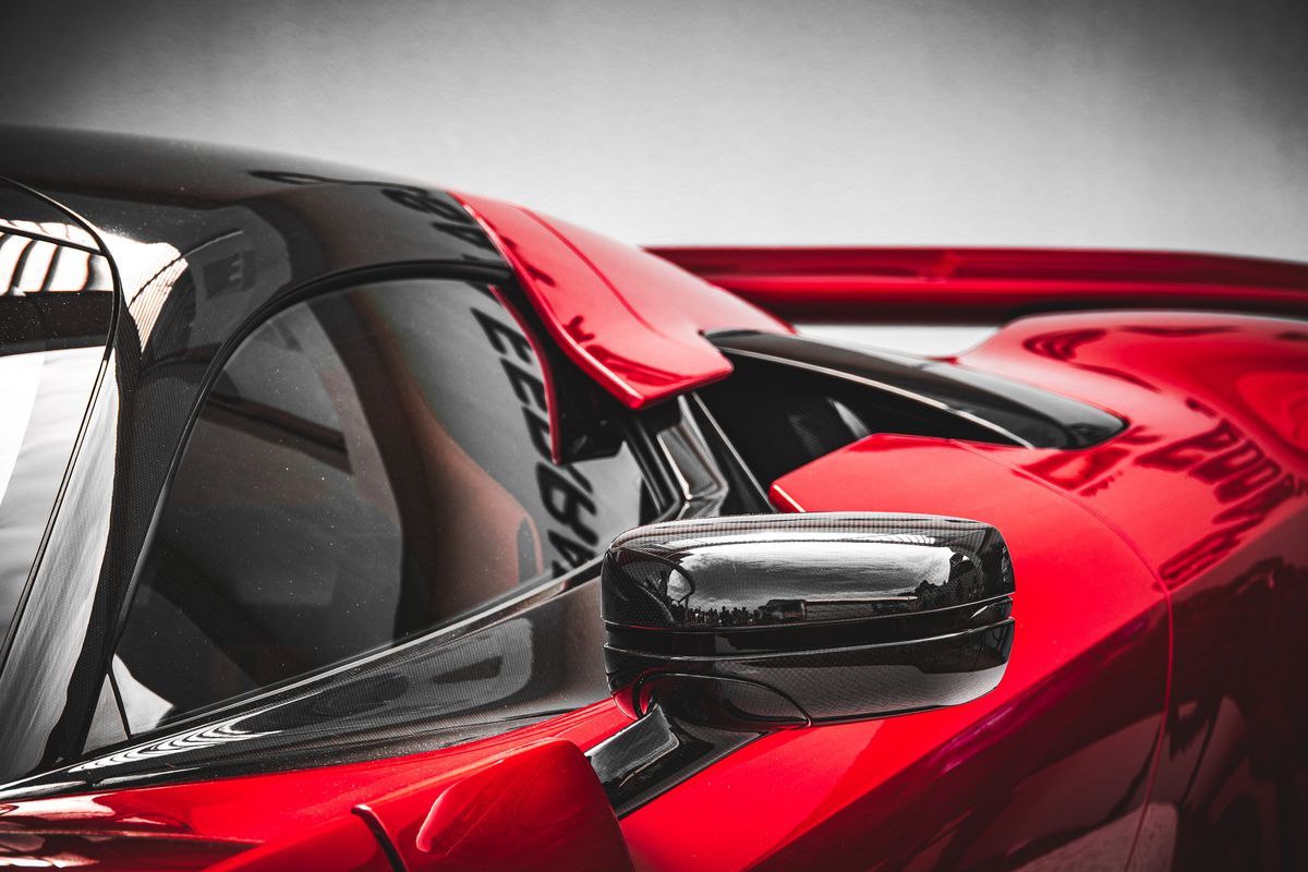 Ferrari F80 side mirror and cockpit detail in red and black