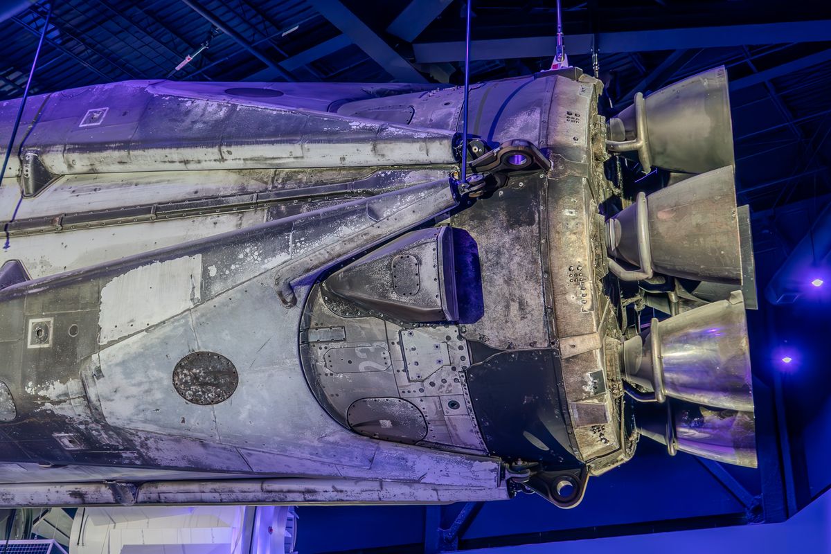 Engine section of a flown rocket booster suspended in the Kennedy Space Center Visitor Complex