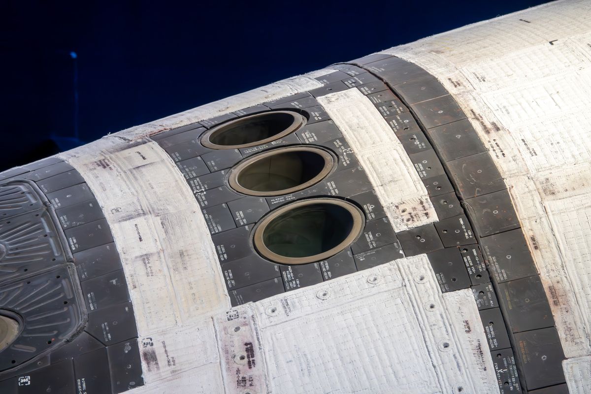 Close-up of Space Shuttle Atlantis nose thrusters and heat shield tiles