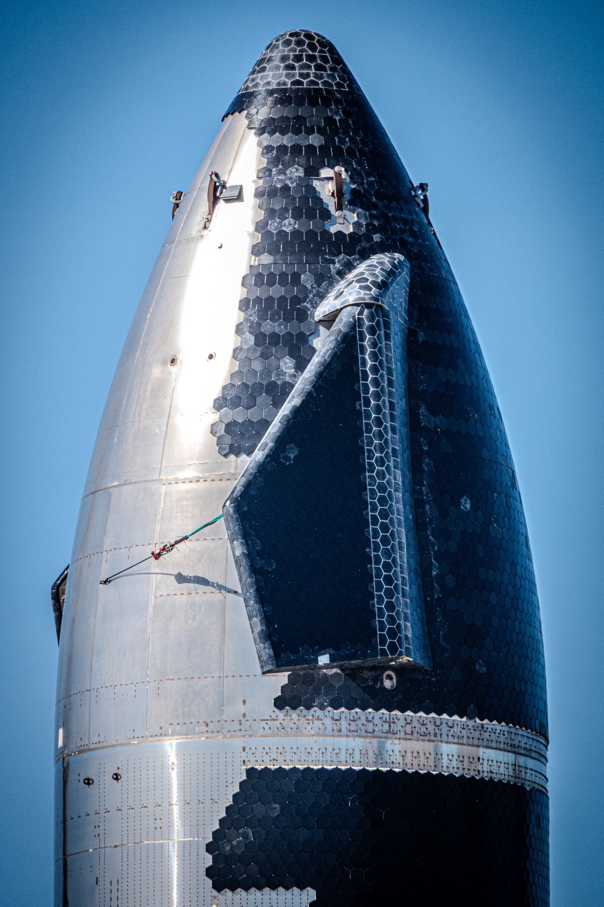 SpaceX Starship nosecone and forward flap with hexagonal heat shield tiles, Starbase, Texas